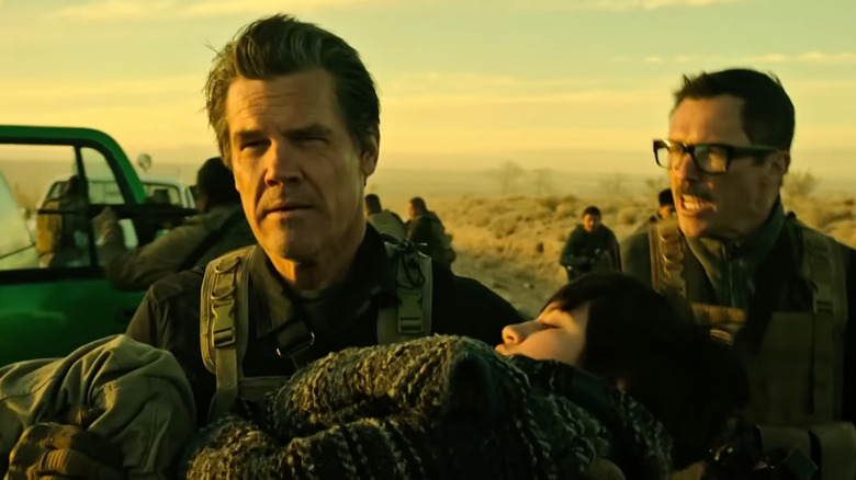 Josh Brolin as Matt Graver carries Isabela Moner as Isabel Reyes in Sicario: Day of the Soldado
