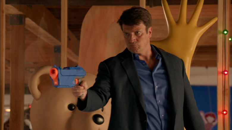 Richard Castle (Nathan Fillion) holding a toy gun on Castle