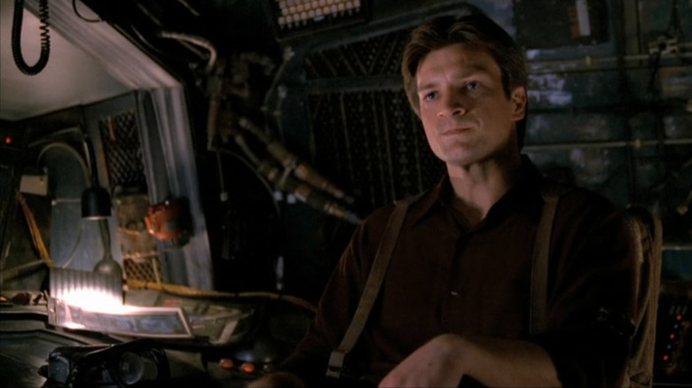 Mal Reynolds (Nathan Fillion) in a spaceship on Firefly