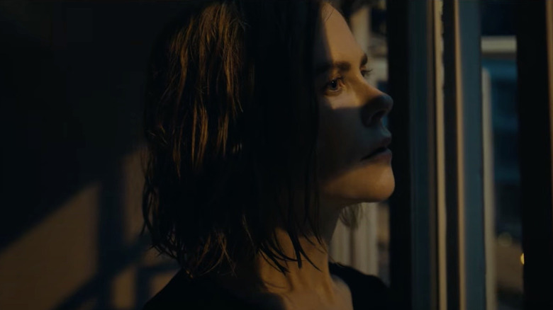 Nicole Kidman as Margaret, staring out the window at sunset in Expats