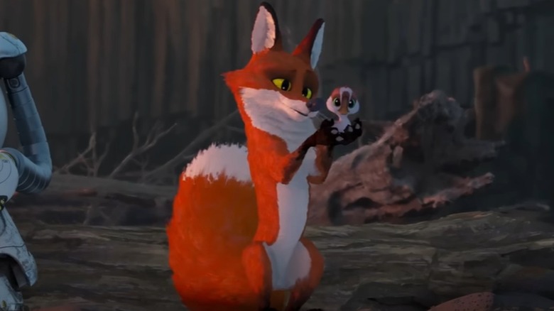 Fink (Pedro Pascal) holds a gosling in The Wild Robot