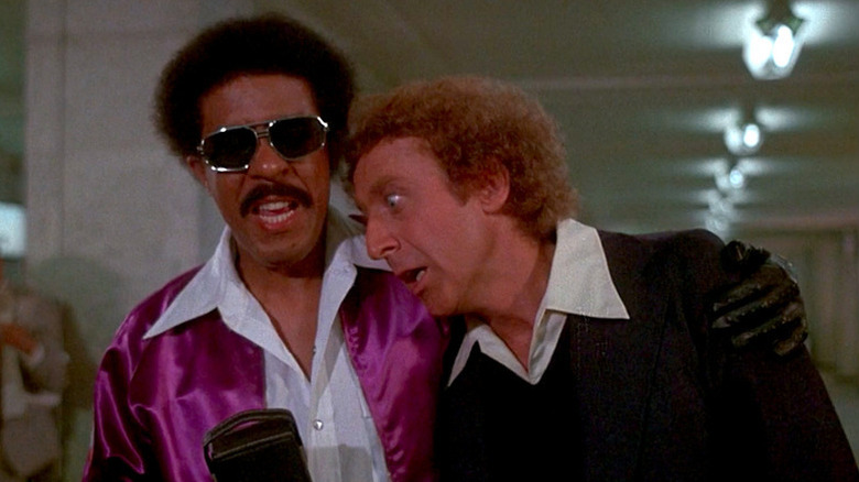 Grover T. Muldoon (Richard Pryor) comforts a distraught George Caldwell (Gene Wilder) in Silver Streak