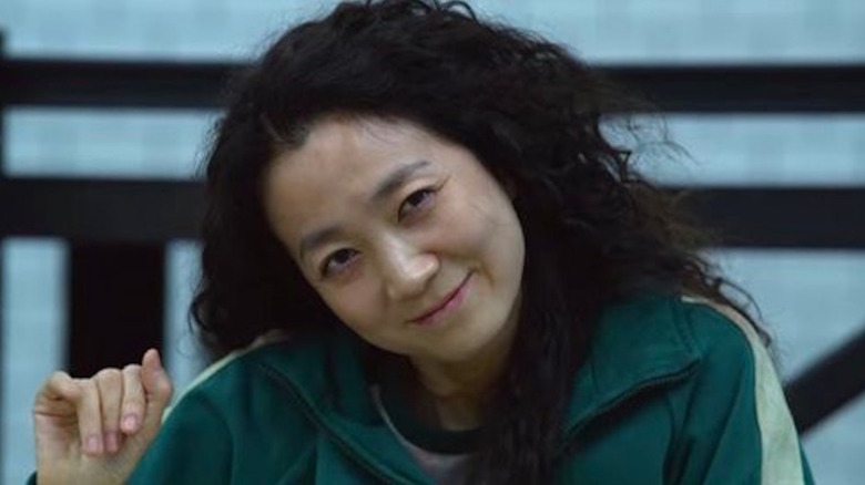 Kim Joo-ryoung's Han Mi-nyeo smiling on Squid Game