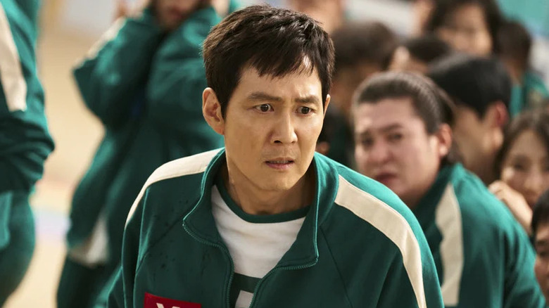 Lee Jung-jae's Seong Gi-hun with a shocked expression on Squid Game