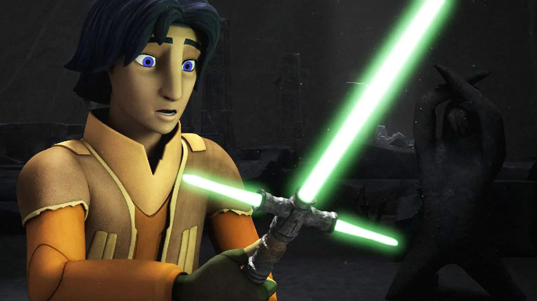 Ezra Bridger (Taylor Gray) stands in awe of a green cross-bladed lightsaber in Star Wars Rebels