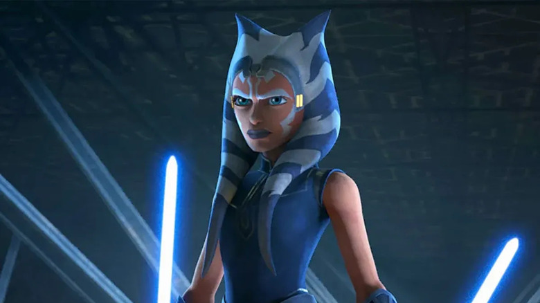 Ahsoka Tano (Ashley Eckstein) stands determined with her lightsabers lit in Star Wars: The Clone Wars