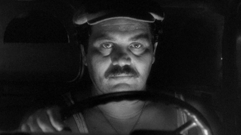 Folco Lulli as Luigi driving the truck in The Wages of Fear