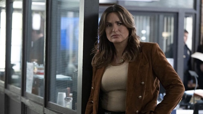 Olivia Benson (Mariska Hargitay) quizzically reclines against a window on Law & Order: Special Victims Unit