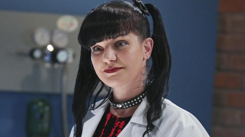 Abby Sciuto (Pauley Perrette) smiles in her forensic lab on NCIS
