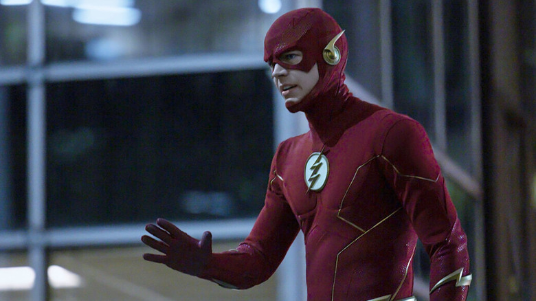 Barry Allen (Grant Gustin) holds up his hand in his Flash costume on The Flash (2014)