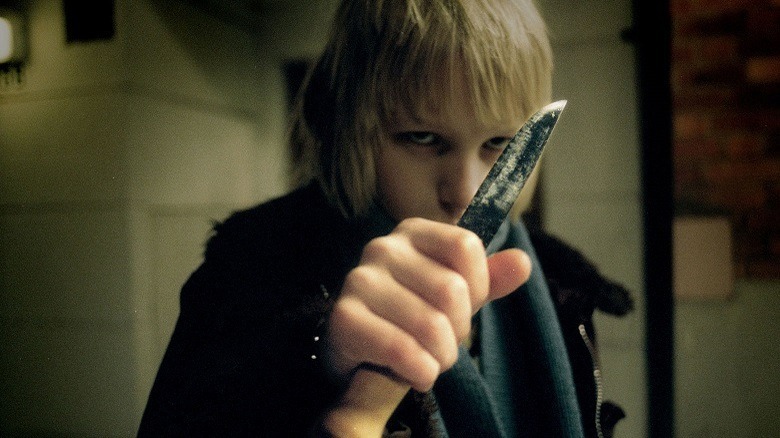 Oskar wields a knife