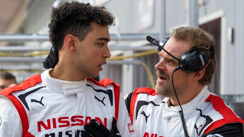 Jann and Jack in the racetrack pit in Gran Turismo (2024)