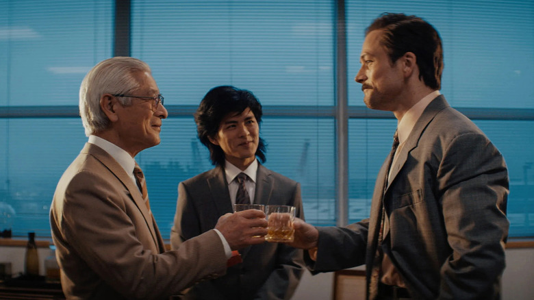 Henk Rogers toasting with Nintendo employees in Tetris (2023)