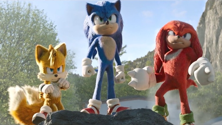 Sonic, Tails, and Knuckles on a rock in Sonic the Hedgehog 2 (2022)