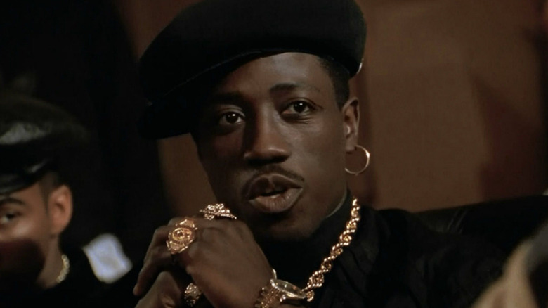 Wesley Snipes as Nino, making deals in New Jack City