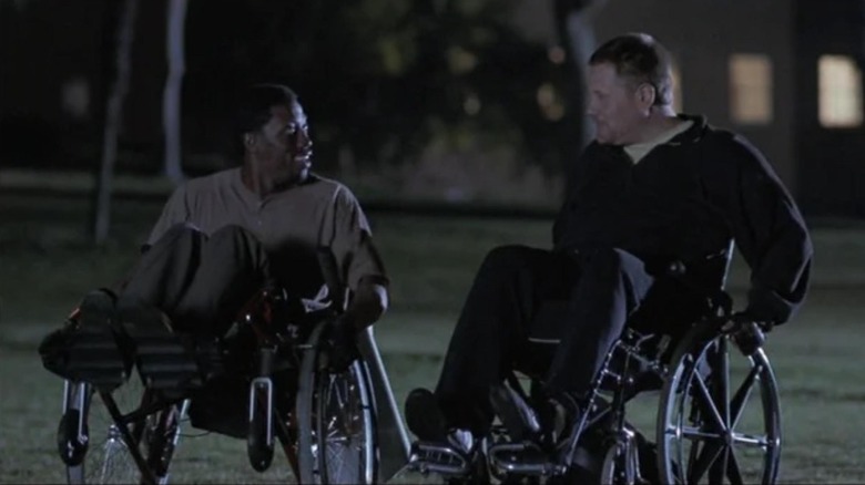 Wesley Snipes as Raymond and William Forsythe as Bloss, doing wheelies in The Waterdance