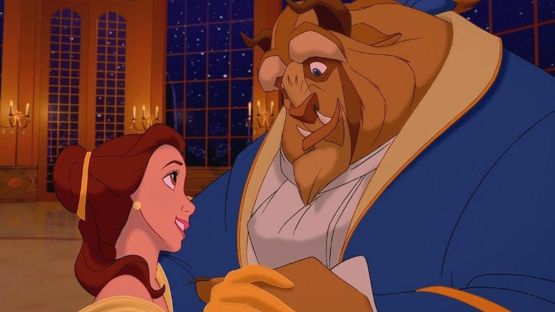 Belle looks lovingly at the Beast