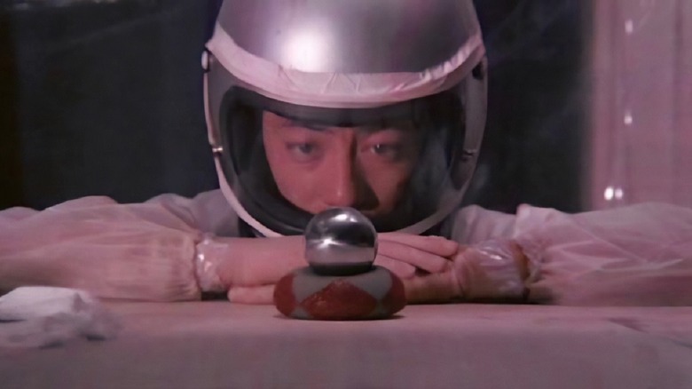 Kenji Sawada as Makoto, admiring his atomic bomb in The Man Who Stole the Sun