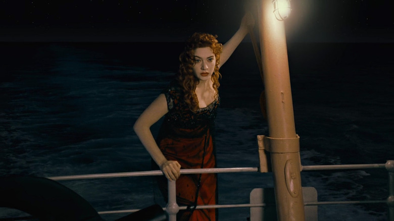 Titanic's Rose climbing over the railing of the boat