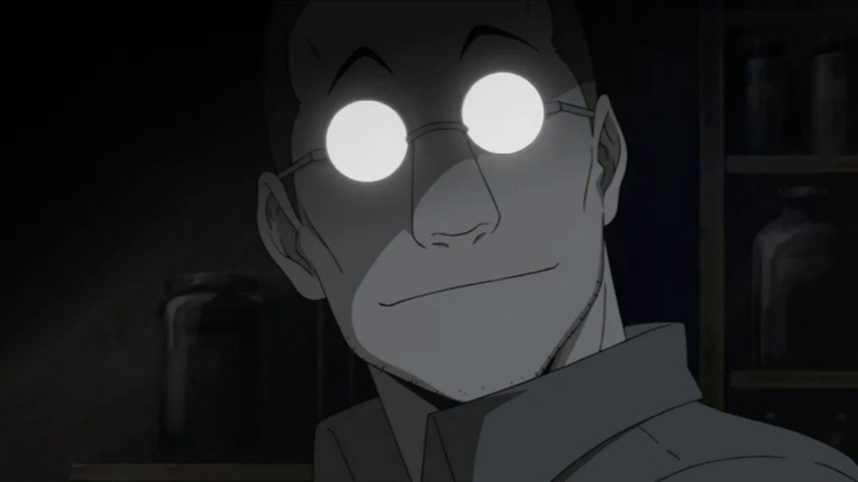 Shou Tucker smiles in the dark with his eyeglasses shining in Fullmetal Alchemist