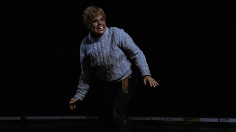 Pamela Voorhees (Betsy Palmer) stands on the beach at night, scowling