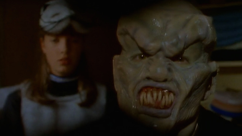 Carly Beth Caldwell (Kathryn Long) tries on the haunted mask Goosebumps (1995)