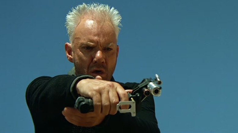 Dr Soran, played by Malcolm McDowell, holds a weapon badly in Star Trek Generations