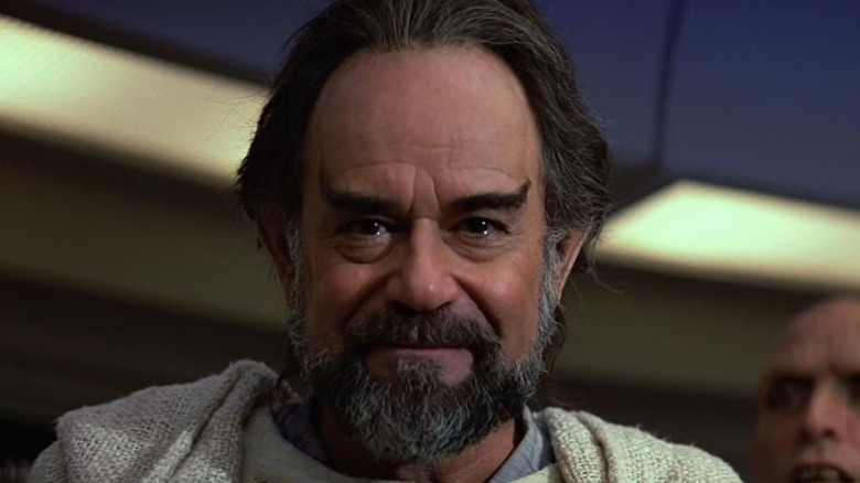 Sybok (Laurence Luckbill) smiles with tears in his eyes in Star Trek V: The Final Frontier