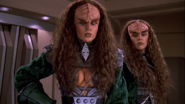 Lursa (Barbara March) and B'Etor (Gwynyth Walsh) look pensive in a boardroom on Star Trek the Next Generation