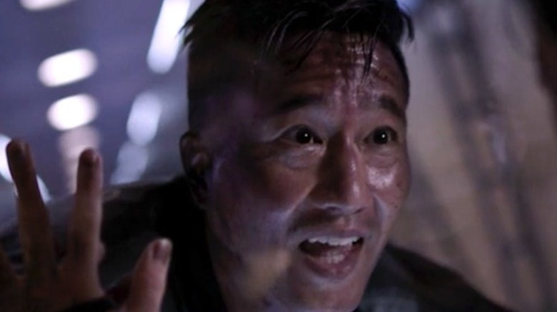 Prax watching a purge with horror on The Expanse
