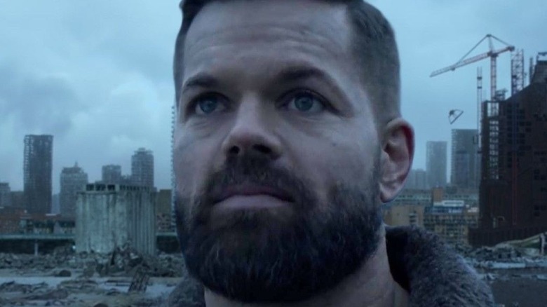 Amos looking at Earth on The Expanse