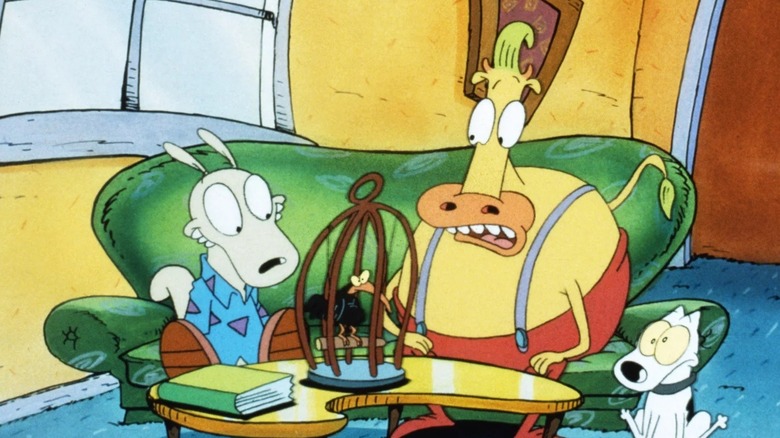 Rocko and Heffer with a caged bird
