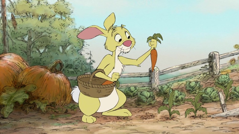 Rabbit picking a carrot from his garden