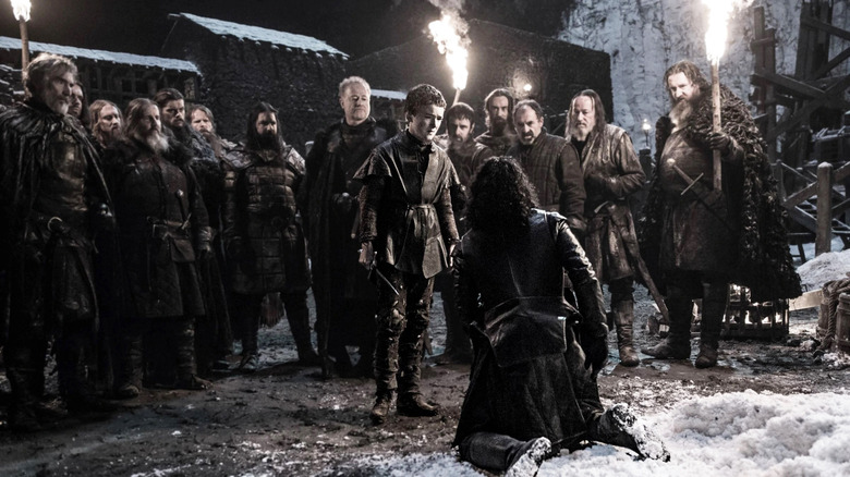 Jon Snow kneeling surrounded Game of Thrones