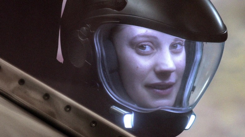 Battlestar Galactica's Starbuck smiles in helmet