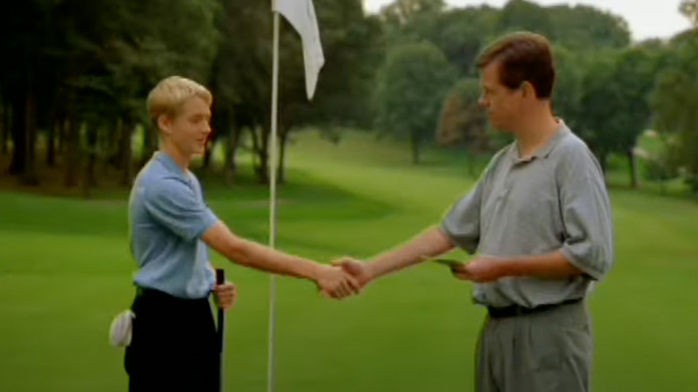 Timmy shakes hands with his dad