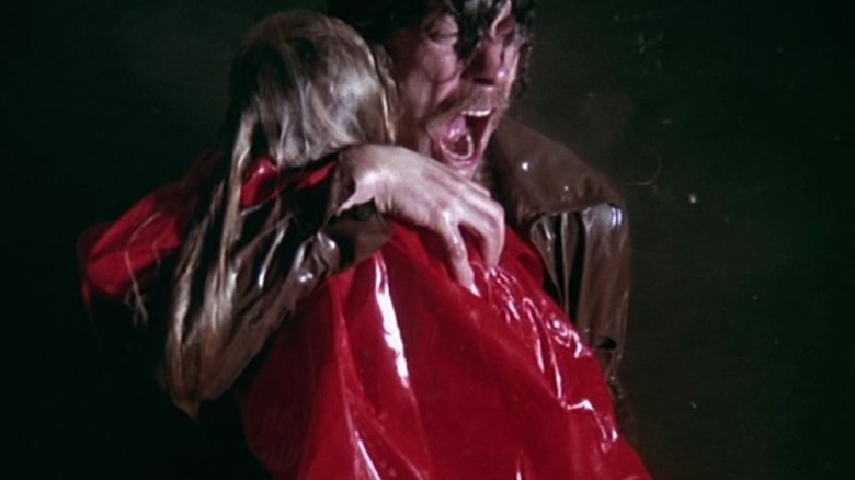 Donald Sutherland holding daughter Don't Look Now