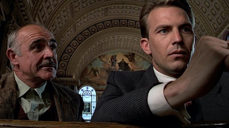 Jim Malone talking to Eliot Ness