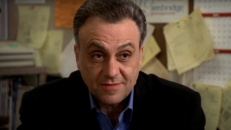 Johnny Sacrimoni (Vincent Curatola) in front of a bulletin board in The Sopranos