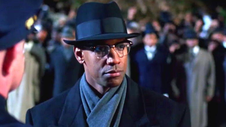 Malcolm X in a hat and coat