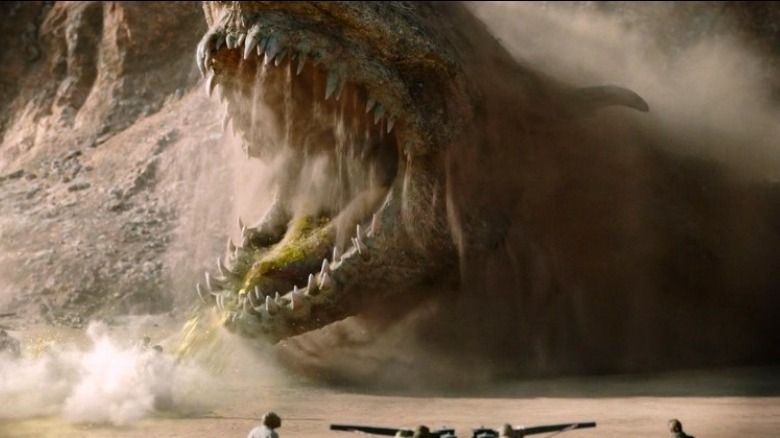 A krayt lunges at Tusken raiders