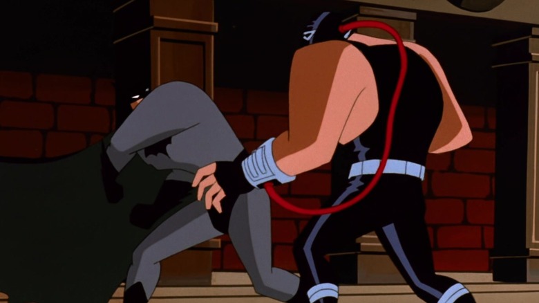 Superman dressed as Batman fights Bane