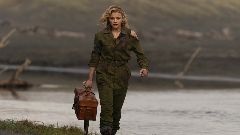 Chloe Grace Moretz marches on beach