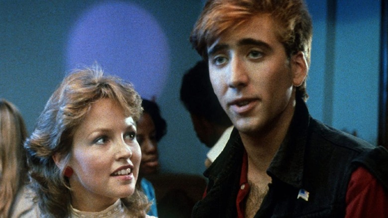 Young Nicolas Cage and Deborah Foreman at party