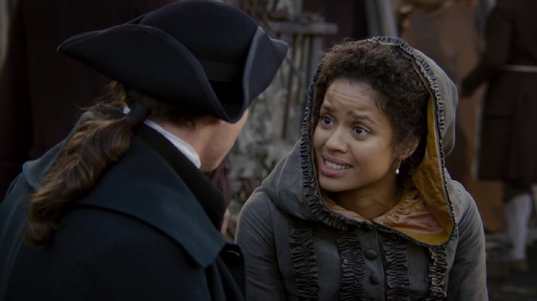 Gugu Mbatha-Raw in "Belle" talks to man in hat