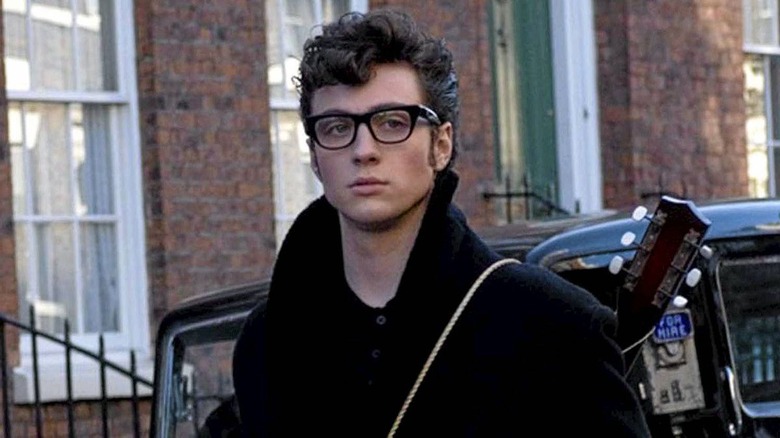 Aaron Taylor-Johnson in "Nowhere Boy" glasses guitar