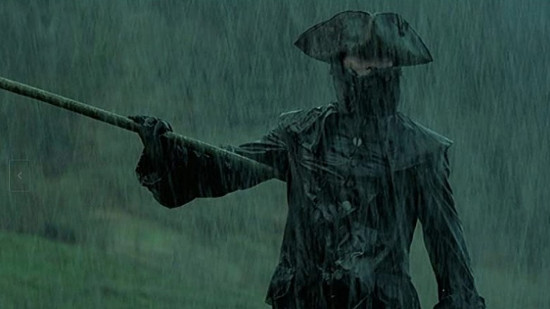 Mark Dacascos with bow staff