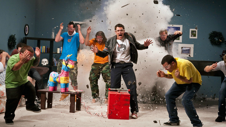 The cast of Jackass 3D in the middle of a debris explosion on set in Jackass 3D