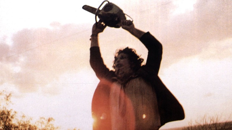 Leatherface wields a chainsaw