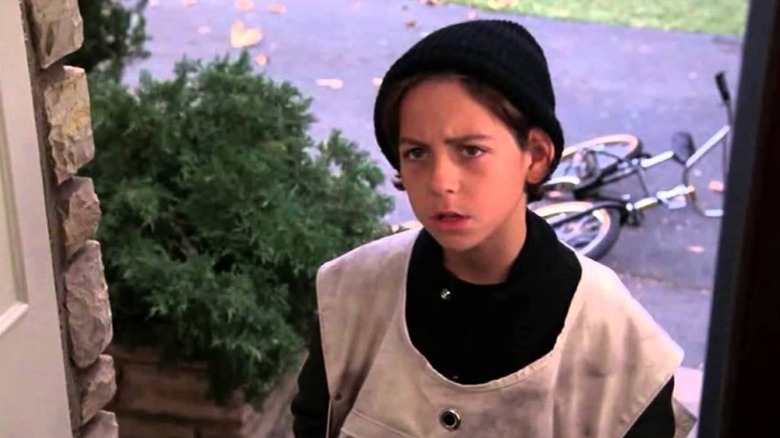 Newspaper boy demanding his $2.00 subscription fee